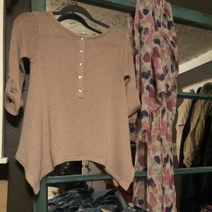 Pink “Coin 1804” knit sweater with floral scarf.